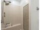 Updated tiled shower stall with dual shower heads, built-in seat, and tiled niche at 2949 E Athena Ave, Gilbert, AZ 85297