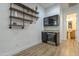 Charming wet bar featuring wood shelves, beverage cooler, and mini fridge at 2949 E Athena Ave, Gilbert, AZ 85297