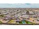 Wide aerial view of the neighborhood, highlighting the home's backyard oasis with a pool at 30878 W Picadilly Rd, Buckeye, AZ 85396
