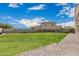 Large backyard featuring a well-maintained lawn and a paver patio, perfect for outdoor gatherings at 30878 W Picadilly Rd, Buckeye, AZ 85396