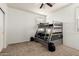Bedroom featuring a bunk bed and carpet flooring at 30878 W Picadilly Rd, Buckeye, AZ 85396