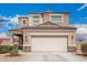 Charming two-story home with a stucco finish and a spacious two-car garage at 30878 W Picadilly Rd, Buckeye, AZ 85396