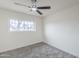 Bright bedroom with a ceiling fan and natural light coming through the window at 3220 E Andorra Dr, Phoenix, AZ 85032