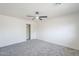 Bedroom with neutral walls, carpet, ceiling fan, and sliding door closet at 3220 E Andorra Dr, Phoenix, AZ 85032