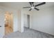 Bright bedroom featuring mirrored closet doors and ensuite bathroom access at 3220 E Andorra Dr, Phoenix, AZ 85032