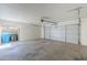 Spacious two-car garage featuring an automatic door opener and ample room for storage at 3220 E Andorra Dr, Phoenix, AZ 85032