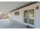 Covered patio with a swing and sliding glass doors offering seamless indoor-outdoor living at 3220 E Andorra Dr, Phoenix, AZ 85032