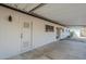 Covered patio with access door and large windows providing natural light into the home at 3220 E Andorra Dr, Phoenix, AZ 85032