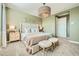 Comfortable bedroom featuring a large bed, stylish lighting, and ample space for relaxation and rest at 3347 E Outlaw Ln, San Tan Valley, AZ 85140