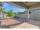 Backyard with desert landscaping, covered patio, and block wall fencing at 3504 E Pinto Dr, Gilbert, AZ 85296