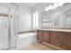 Bright bathroom with double vanity, soaking tub with shower, and natural light at 3504 E Pinto Dr, Gilbert, AZ 85296
