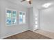 A sunlit bedroom featuring neutral carpet, a ceiling fan, and double windows for ample natural light at 3504 E Pinto Dr, Gilbert, AZ 85296