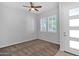 Bright bedroom with neutral carpet, ceiling fan, and double windows allowing natural light at 3504 E Pinto Dr, Gilbert, AZ 85296