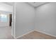 An empty room with tile floor; kitchen cabinets visible in the background at 3504 E Pinto Dr, Gilbert, AZ 85296