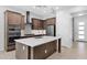 Modern kitchen with stainless steel appliances, a large island, and stylish cabinetry at 3504 E Pinto Dr, Gilbert, AZ 85296