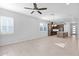 Bright living room featuring tile floors and an open layout that connects to the kitchen and dining areas at 3504 E Pinto Dr, Gilbert, AZ 85296