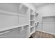Spacious walk-in closet with built-in shelving and clothing racks for optimal organization at 3504 E Pinto Dr, Gilbert, AZ 85296