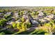 An aerial view of a neighborhood showcasing lush landscaping and a variety of home styles at 3683 E Nolan Dr, Chandler, AZ 85249