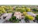 Gorgeous home with manicured front lawn, mature trees, and an attached porte-cochere garage in a quiet neighborhood at 3683 E Nolan Dr, Chandler, AZ 85249