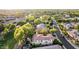 An aerial view of a neighborhood showcasing lush landscaping, pond, and a variety of home styles at 3683 E Nolan Dr, Chandler, AZ 85249