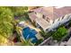 An aerial view showcases the home's backyard featuring a pool, outdoor seating area, patio, and putting green at 3683 E Nolan Dr, Chandler, AZ 85249