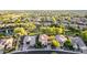A peaceful suburban neighborhood features beautiful homes with well-kept lawns, mature trees, and a serene lake at 3683 E Nolan Dr, Chandler, AZ 85249