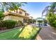 Wide backyard featuring a putting green, mature trees, and a pool with an outdoor dining set at 3683 E Nolan Dr, Chandler, AZ 85249