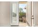 A serene balcony view with a charming white shuttered door and wrought iron railing, inviting relaxation at 3683 E Nolan Dr, Chandler, AZ 85249
