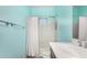 A well-lit bathroom features a shower-tub combination and a bright blue accent wall at 3683 E Nolan Dr, Chandler, AZ 85249