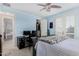 This blue bedroom includes a bed, desk, closet, and balcony access at 3683 E Nolan Dr, Chandler, AZ 85249