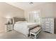 A comfortable bedroom features neutral decor, a stylish bed, and ample natural light at 3683 E Nolan Dr, Chandler, AZ 85249
