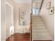 Inviting entryway features hardwood floors, staircase, decor niche, and neutral paint tones at 3683 E Nolan Dr, Chandler, AZ 85249