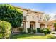 Attractive two-story property with a well-kept lawn, verdant landscaping, and convenient porte-cochère at 3683 E Nolan Dr, Chandler, AZ 85249