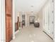 Upstairs hallway features neutral carpet, wood railing, and French doors for relaxing and enjoying the natural light at 3683 E Nolan Dr, Chandler, AZ 85249