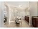 Elegant bathroom with dual vanities, shower, soaking tub and access to an additional seating area at 3683 E Nolan Dr, Chandler, AZ 85249