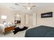Spacious primary bedroom with carpet floors, a ceiling fan, and views to the en suite bathroom at 3683 E Nolan Dr, Chandler, AZ 85249