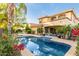Backyard oasis featuring a refreshing pool, mature trees, and a putting green with outdoor dining area at 3683 E Nolan Dr, Chandler, AZ 85249