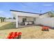 Expansive backyard showcasing a covered patio, hanging chairs, a lush lawn, and plenty of room to entertain at 4025 N 8Th Ave, Phoenix, AZ 85013