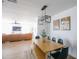 Open dining room area with hardwood floors, a wooden table, and views into the living room at 4025 N 8Th Ave, Phoenix, AZ 85013