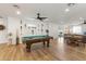 Bright game room with a pool table, neon lighting, hardwood floors, and a dining table at 4025 N 8Th Ave, Phoenix, AZ 85013