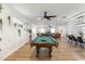 Large game room with a pool table, hardwood floors, neon wall art, and plenty of space at 4025 N 8Th Ave, Phoenix, AZ 85013