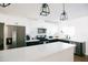 Bright kitchen with stainless steel appliances, white cabinets, dark countertops, and a large island at 4025 N 8Th Ave, Phoenix, AZ 85013