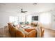Spacious living room with hardwood floors, a large sectional sofa, and plenty of natural light at 4025 N 8Th Ave, Phoenix, AZ 85013