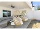 Stylish patio with hanging chairs, modern ceiling fan, and spacious seating area for relaxation at 4025 N 8Th Ave, Phoenix, AZ 85013