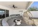 Relaxing covered patio features comfortable seating, hanging chairs, a fire pit, and a hot tub for entertaining at 4025 N 8Th Ave, Phoenix, AZ 85013