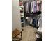 Organized walk-in closet filled with a variety of clothes and shoes, perfect for storage at 4242 N 27Th St # 2, Phoenix, AZ 85016