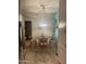 Cozy dining area featuring a modern light fixture, wooden table, and stylish decor at 4242 N 27Th St # 2, Phoenix, AZ 85016