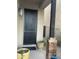 Elegant front door with black hardware, flanked by planters and a stone pillar at 4242 N 27Th St # 2, Phoenix, AZ 85016