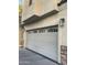 Garage door with window panes on a tan home exterior at 4242 N 27Th St # 2, Phoenix, AZ 85016