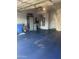 Spacious two car garage with painted floor, storage cabinets, and ample space for vehicles and projects at 4242 N 27Th St # 2, Phoenix, AZ 85016